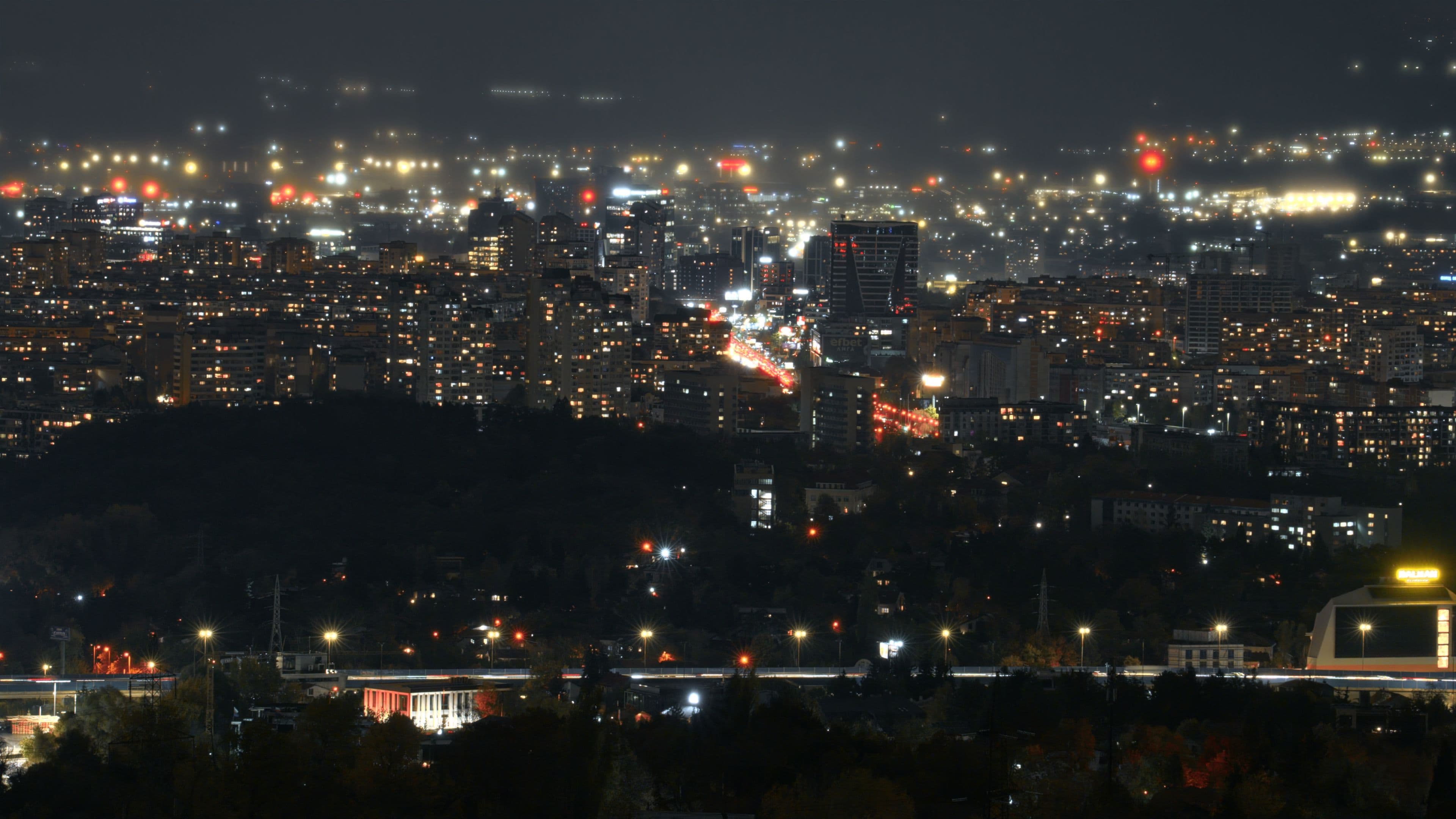 Rainy Sofia cityscape with a skyscraper in a foggy, misty weather