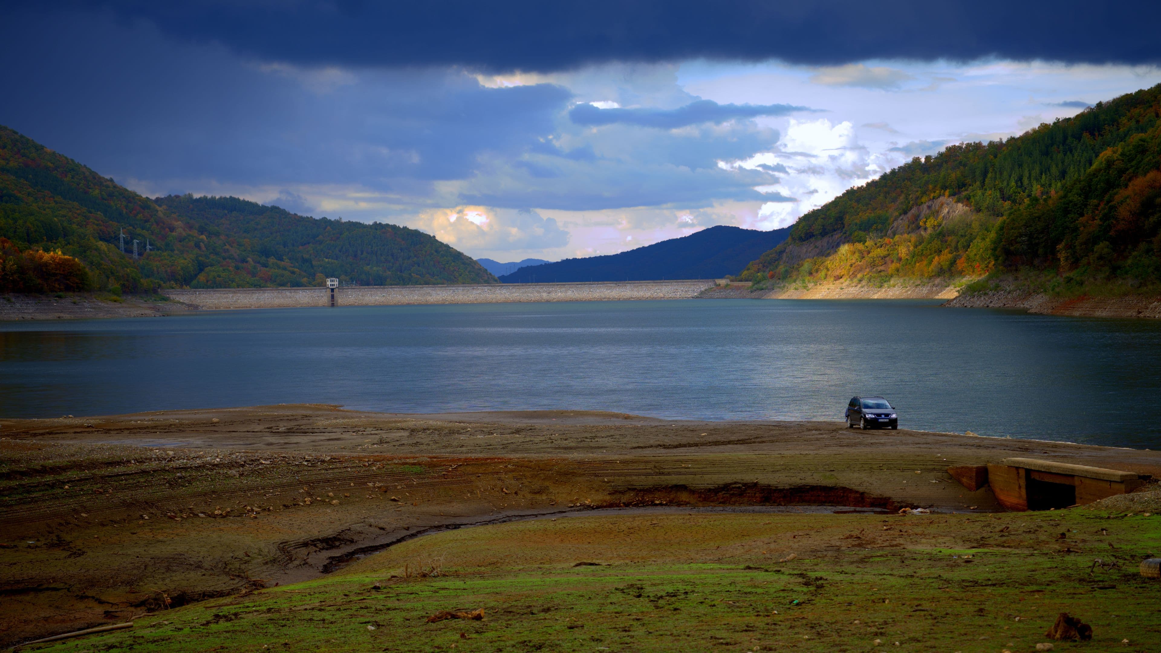 Fisherman at the Bebresh reservoir with the dam in the distance