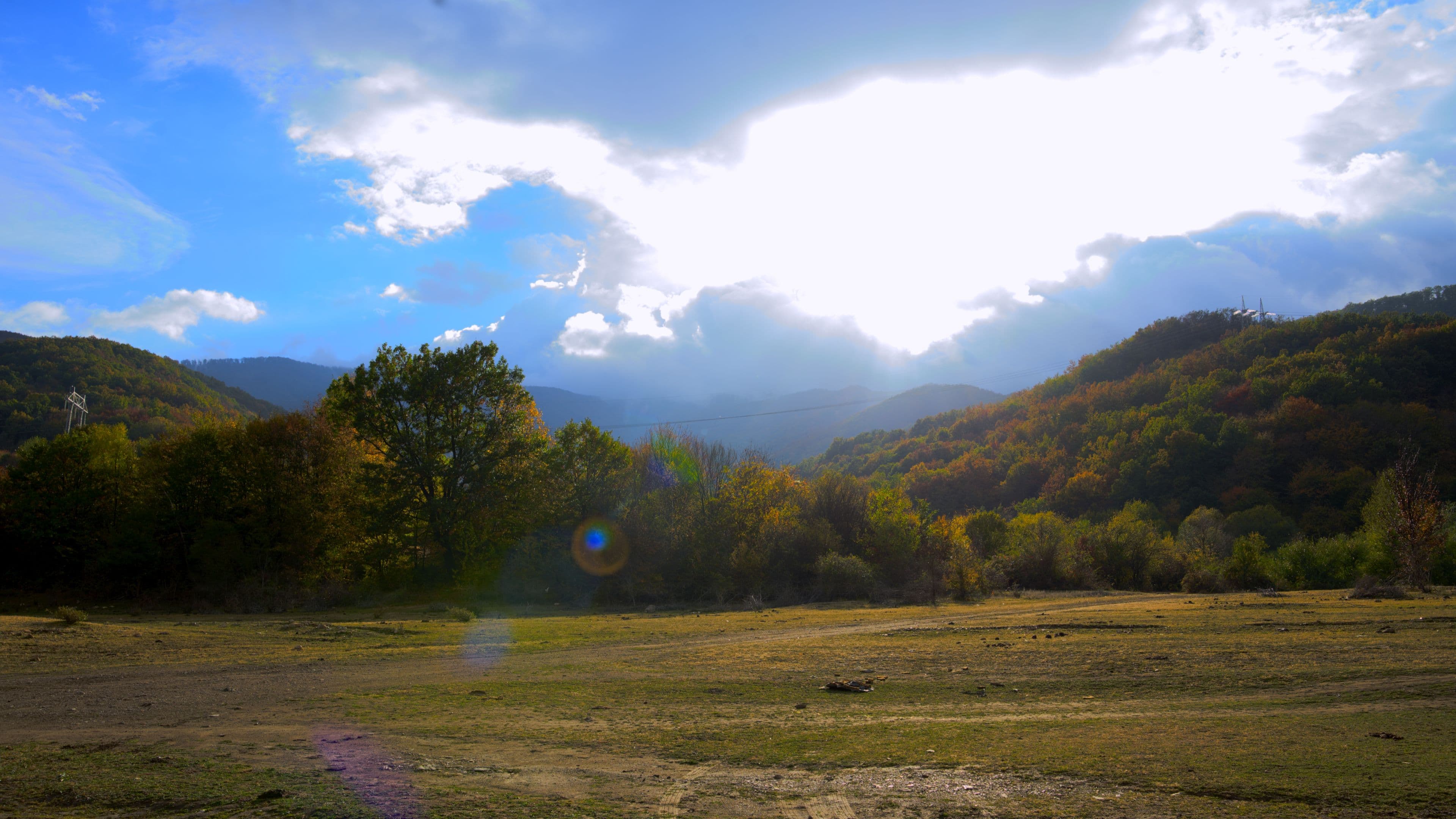 Autumn meadow under the sun and rain