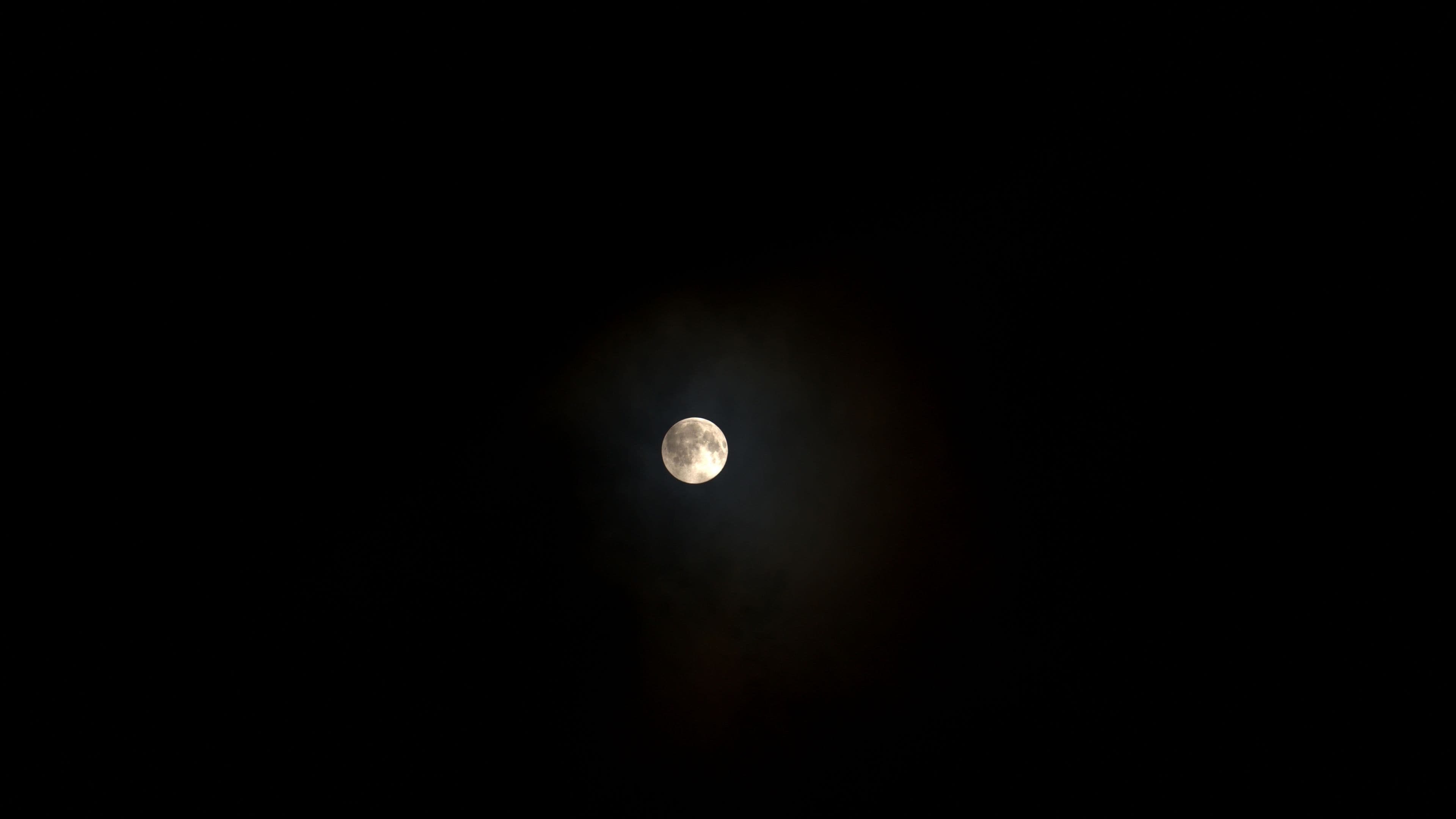 Moon in Skravena above the clouds